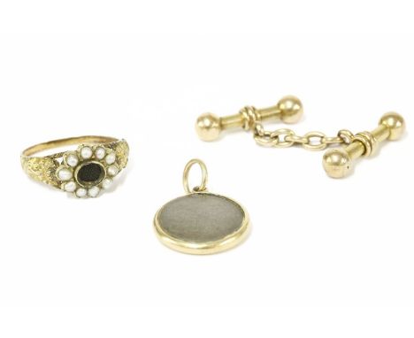 A single gold dumbbell chain link cufflink (tested as 15ct gold), a gold engine turned decorated picture locket, together wit