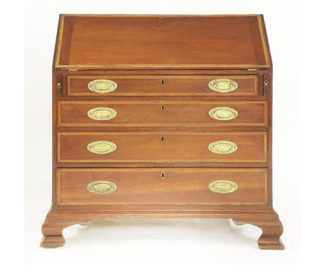 A large George III strung and crossbanded mahogany bureau,with a fitted interior over four long graduated drawers and ogee br