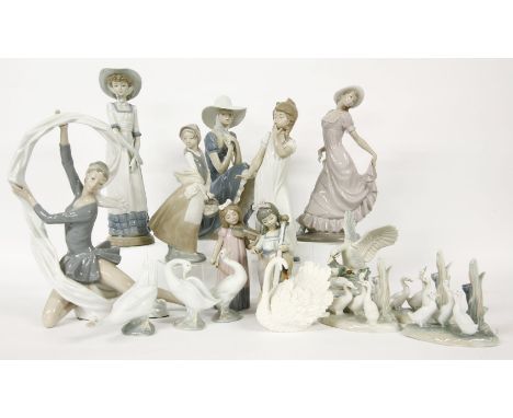 A large collection of Nao and Lladro figurines, together with further porcelain figurines.