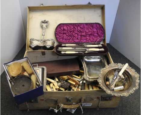 A suitcase of silver plated items, cutlery, cased carving set, hairbrushes, tureens, etc