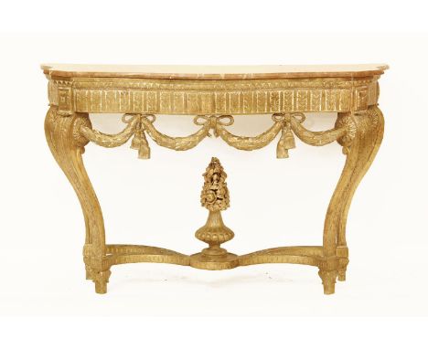 A red marble topped console table, the serpentine front over carved and gilt base with ribbon tied swag decoration, (crack to