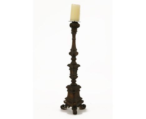 An antique carved and giltwood candlestick,  90cm to the top of candle