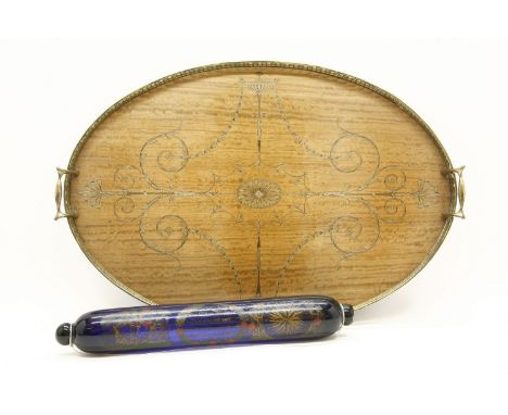An Edwardian inlaid mahogany oval tray with brass gallery, 59 x 39cm, together with a blue glass rolling pin