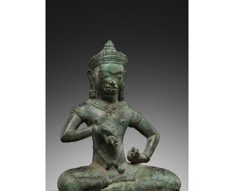 A BRONZE FIGURE OF VAJRASATTVA, BAYON STYLE, ANGKOR PERIODKhmer Empire, 12th century. Finely cast seated holding the vajra an