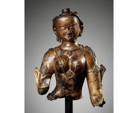 A LARGE FRAGMENTARY BUST OF A FEMALE DEITY, GILT COPPER-ALLOY, PROBABLY DENSATIL, TIBET, 14TH-15TH CENTURYOpinion: The partic