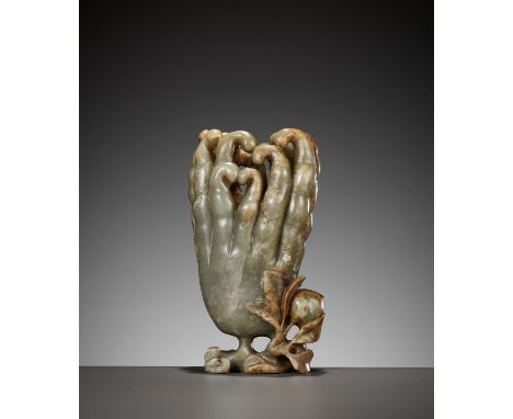 A CELADON AND RUSSET JADE 'FINGER CITRON' VASE, 17TH - 18TH CENTURYChina. Naturalistically carved issuing from a gnarled leaf