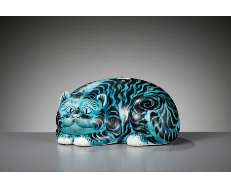 AN IMPORTANT AND RARE BLACK AND TURQUOISE 'CAT' PORCELAIN NIGHTLIGHT, KANGXIChina, 1661-1722. The crouched feline with the ta