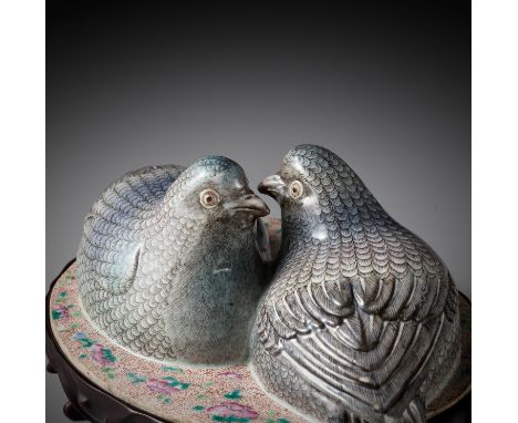 A FAMILLE ROSE MODEL OF A PAIR OF QUAILS, QING DYNASTYChina, 19th century. The birds perched side by side, their heads slight