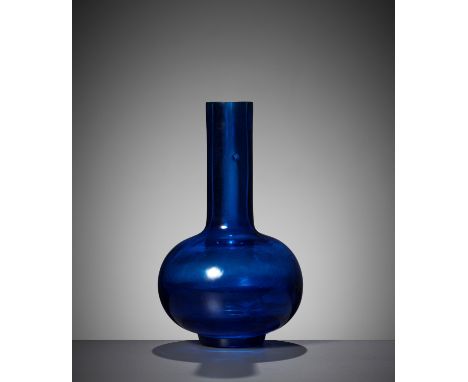 A RARE AQUAMARINE BLUE GLASS BOTTLE VASE, QIANLONG MARK AND PERIODChina, 1736-1795. The remarkably thick-walled, globular bod