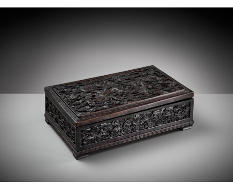 AN IMPERIAL 'DRAGON' HARDWOOD CHEST, COMMEMORATING THE RENOVATION OF THE JADE PEAK PAGODA BY EMPEROR QIANLONGOpinion: The Jad