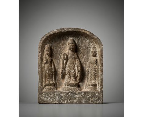 A SANDSTONE 'BUDDHIST TRIAD' STELE, TANG DYNASTY, DATED 717China. Well carved in deep relief, the arched niche centered by a 