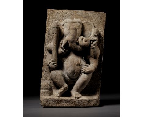 A BUFF SANDSTONE FIGURE OF DANCING GANESHA, MAHAGANAPATI, 10TH CENTURYCentral India. Carved as a dancing Ganesha with his rig