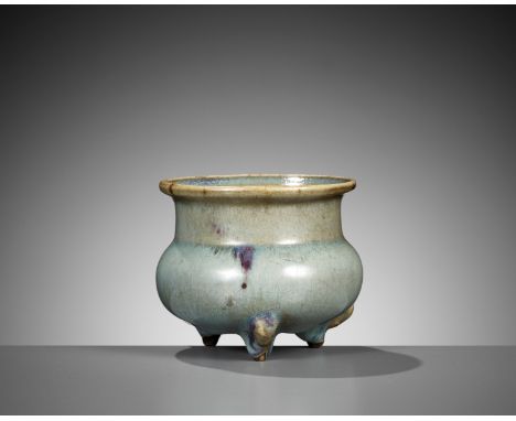 A JUNYAO PURPLE-SPLASHED TRIPOD CENSER, JIN TO YUAN DYNASTYChina, 12th-14th century. The compressed body is raised on three c
