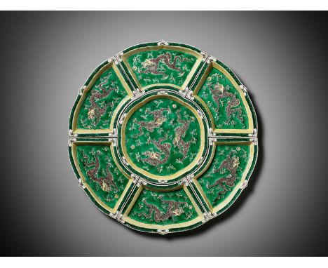 A FAMILLE VERTE 'DRAGON' SWEETMEAT SET, KANGXI PERIODChina, 1662-1722. The central dish of six-lobed form enameled in green, 