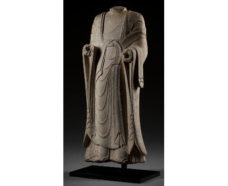 A LARGE AND HIGHLY IMPORTANT WHITE MARBLE TORSO OF BUDDHA, NOTHERN QI DYNASTYChina, 6th century. Depicting a standing Buddha,