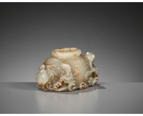 A FINE CELADON JADE 'FISH BASKET' BRUSH WASHER, 18TH-19TH CENTURYChina. Finely carved and well hollowed in the form of a fish