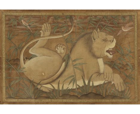 'LION AT REST', MUGHAL EMPIRE1526-1857. Watercolors on paper. The resting lion reclining in a bamboo grove within a rocky lan