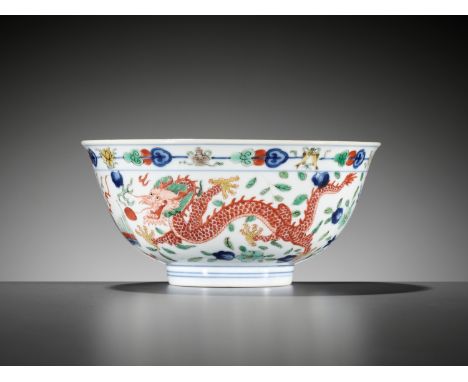 A WUCAI 'DRAGON AND PHOENIX' BOWL, QIANLONG MARK AND PERIODChina, 1736-1795. With deep rounded sides rising to an everted rim