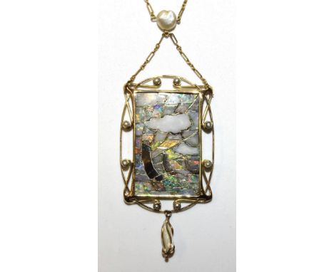 An Arts &amp; Crafts pendant in the manner of Archibald Knox, of rectangular form inlaid with opal and hardstone mosaic and d