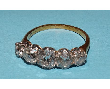 A Victorian five-stone diamond ring claw-set old brilliant-cut diamonds, in unmarked yellow and white gold mount, (tests as 1