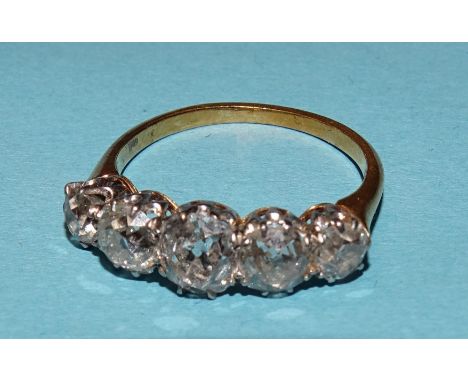 A Victorian five-stone diamond ring claw-set old brilliant-cut diamonds, in unmarked yellow and white gold mount, (tests as 1