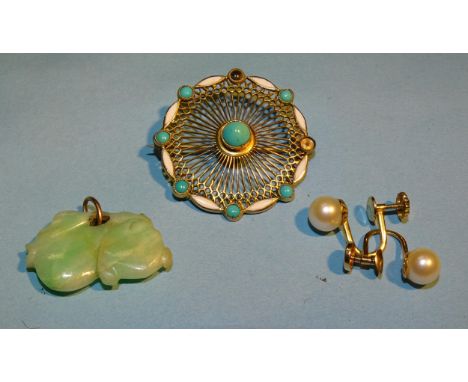 A small carved jade pendant on gold bale, 26 x 15mm, an Edwardian enamelled target brooch with pierced decoration, set turquo