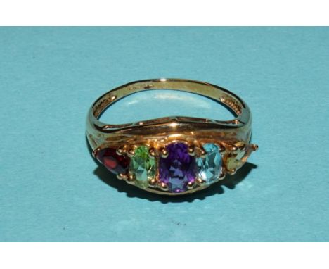 A 9ct gold rainbow ring set various gems, size P, 2g, (boxed). 