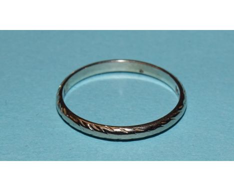 An 18ct white gold wedding band, size O, 1.8g. 