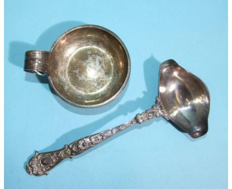 A Continental silver ladle with cast handle and double-spout bowl, stamped .930 and a metal wine taster, (2). 