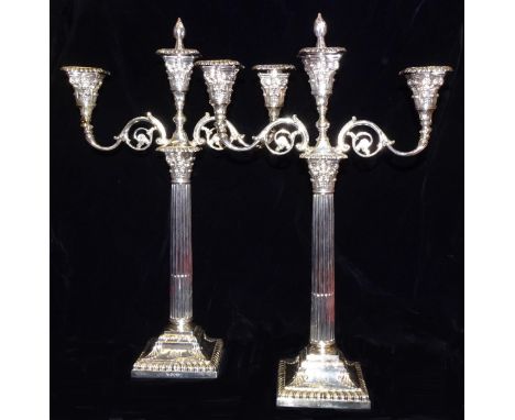 A pair of late-Victorian silver three-branch candelabra, on Corinthian columns and square loaded bases, 51cm high, Sheffield 