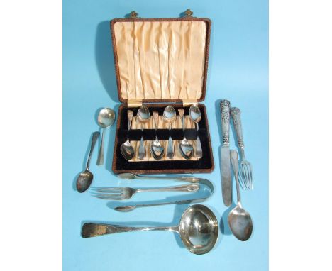 A William IV silver ladle, London 1831, maker Charles Boyton, six cased silver coffee spoons, Sheffield 1931, a pair of sugar