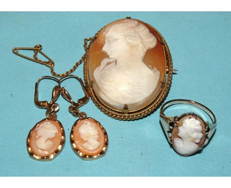 A 9ct gold ring set shell cameo, size N½, 2.8g, a pair of shell cameo pendant earrings in gold-plated mounts and a cameo broo