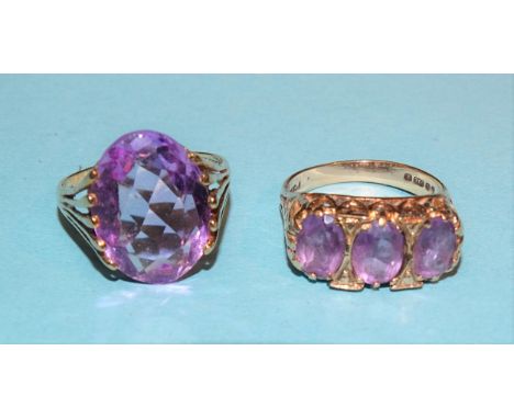 An amethyst dress ring in 9ct gold mount, size O and another set three amethysts, size M, 7g, (2). 