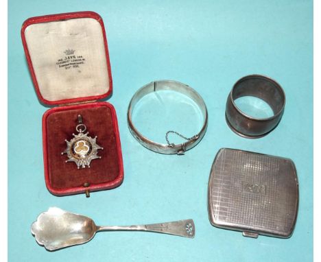 A modern silver compact, 7 x 6cm, Birmingham 1972, a silver bracelet, napkin ring and other items. 