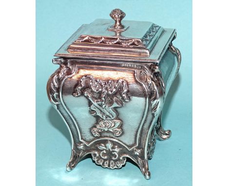 A late-Victorian rectangular tea caddy of bombe shape, embossed with ribbon-tied musical instruments, maker William Comyns, L