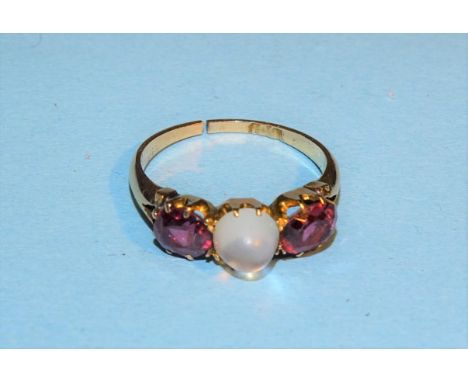 A Victorian 15ct gold ring claw-set a moonstone and two garnets, size K, 2.3g. 