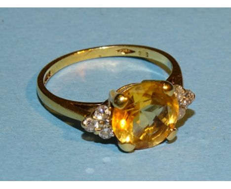 An 18ct gold ring set citrine and diamond points, size N, 3g. 