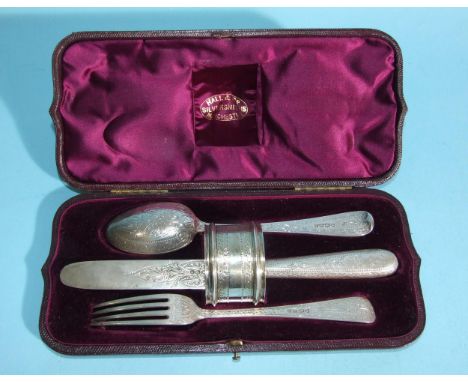 A Victorian four-piece silver christening set, including napkin ring, with overall bright-cut engraved decoration, London 187