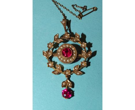 A 9ct yellow gold Edwardian brooch/pendant set synthetic ruby and pearl cluster within a pearl-set wreath, with synthetic rub