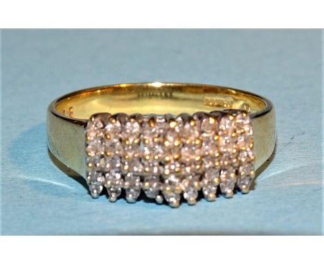 An 18ct yellow gold ring set a rectangular cluster of 8/8-cut diamonds, size O½, 4.3g. 