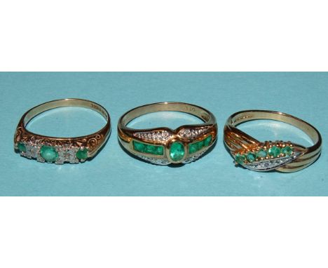 An emerald and diamond point cluster ring set an oval and six square-cut emeralds, in 9ct gold mount, size O and two other 9c