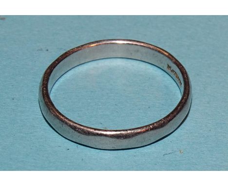 A platinum wedding band, 3mm wide, size K½. 