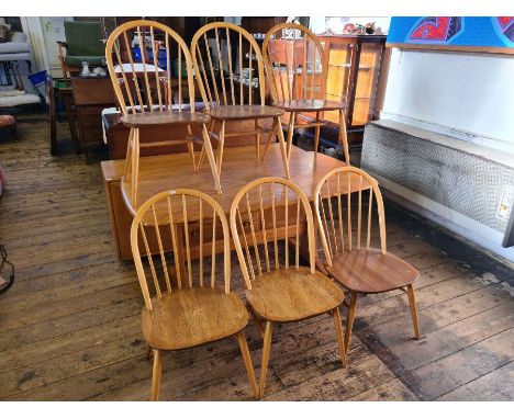 Ercol blonde Windsor dining table 5' x 2'9" with 6 matching Windsor kitchen chairs.