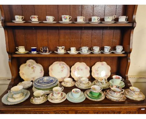 Collection of 18 decorative porclain cups and saucers together with 10 similar trios, Victorian limoge dessert tablewares and