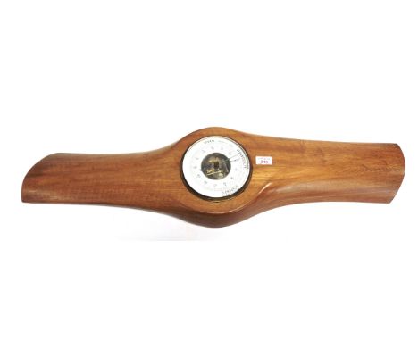 A PROPELLER ART BAROMETER  the circular aneroid barometer inscribed in Dutch, and set to the centre section of a laminated wo