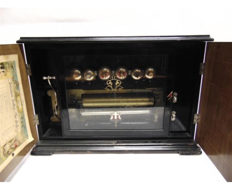 A 'BELLS IN SIGHT' UPRIGHT MUSICAL BOX  Swiss, late 19th century, the 28cm pinned cylinder set to a gilded steel bed, playing