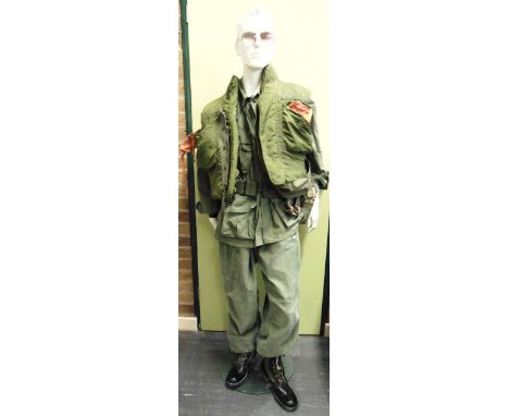 A VIETNAM WAR (1965-1975) U.S. INFANTRYMAN'S 'GRUNT' UNIFORM  comprising a poplin combat coat 3rd pattern, M65 field trousers