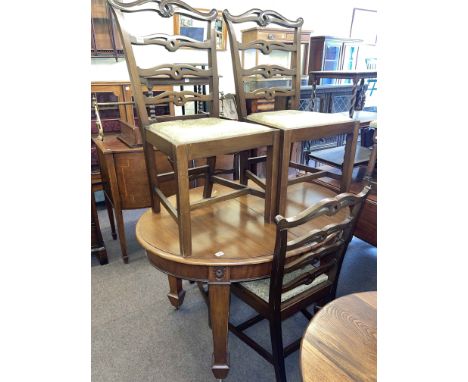 Edwardian oval mahogany extending dining table, leaf and winder, four ladder back dining chairs, two door bow front sideboard