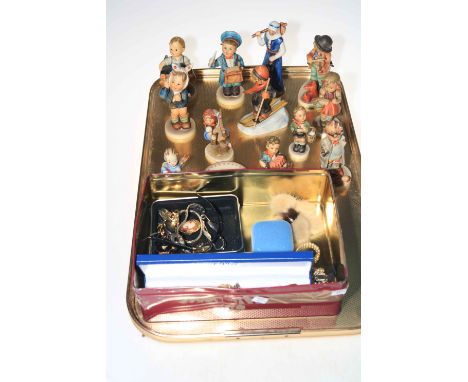 Twelve Hummel figures and two small dishes, costume jewellery and watches.