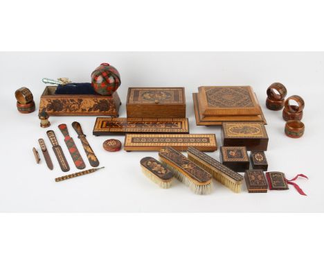 A Tunbridge ware sewing stand, 19th Century, on bun feet, with a lifting tray upholstered with a blue velvet needle cushion, 